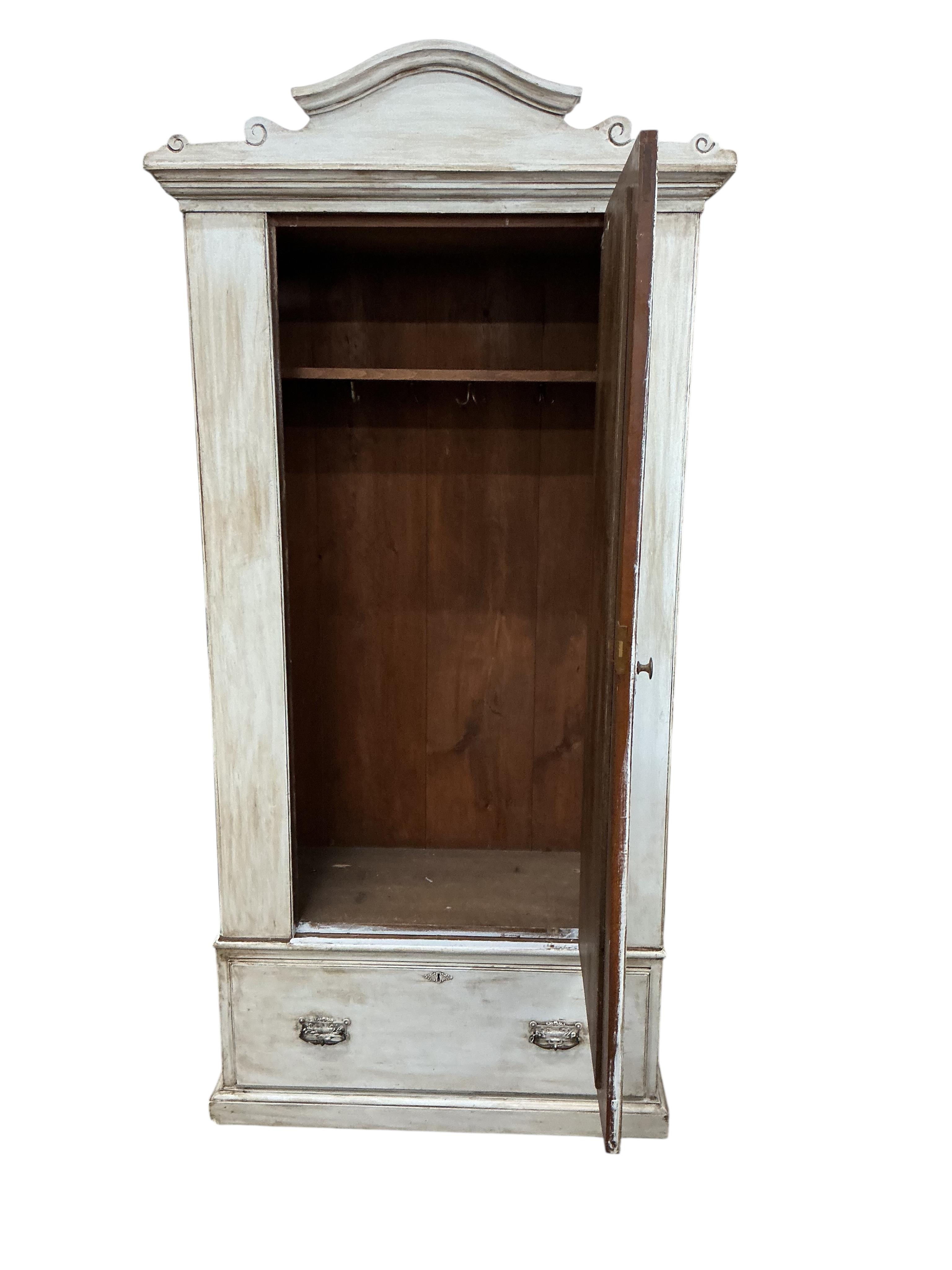 A wardrobe, later painted, width 112cm, depth 61cm, height 228cm